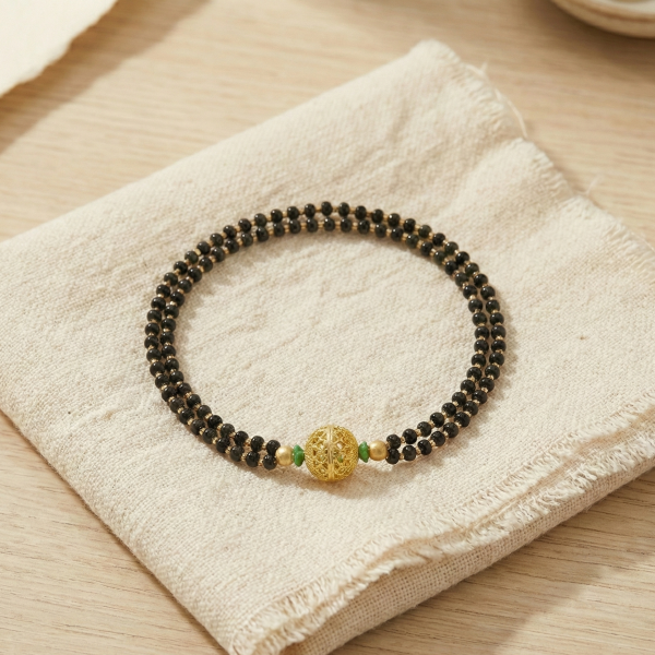 Luxury Double-Strand Black Bead Bracelet with Gold Center Charm